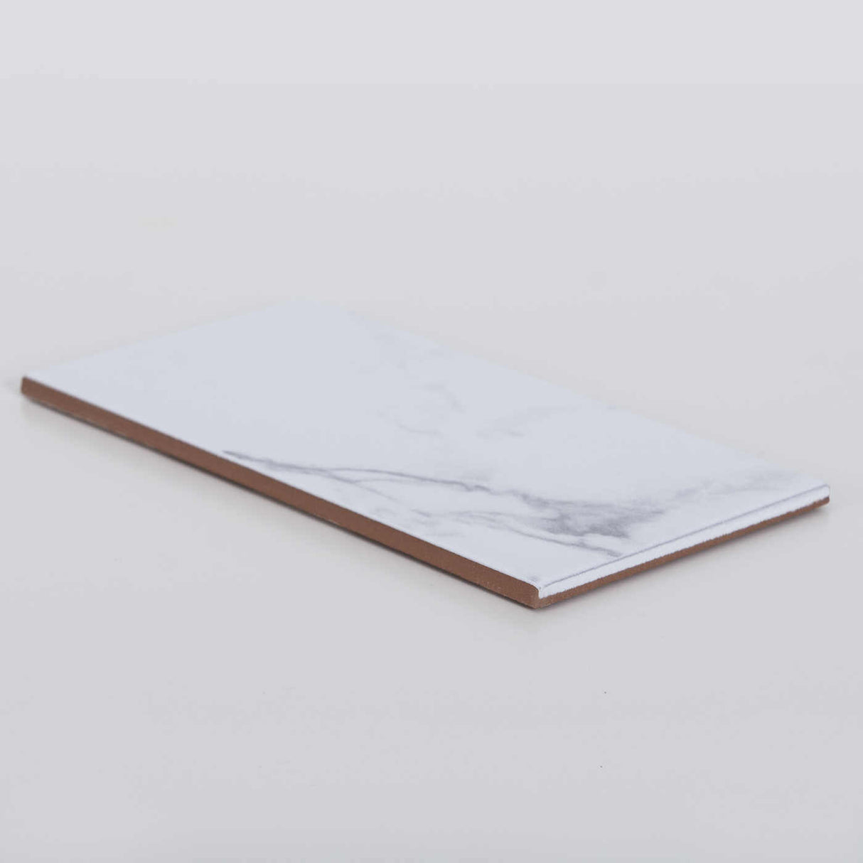 Veggflis Carrara Marmor 10x20